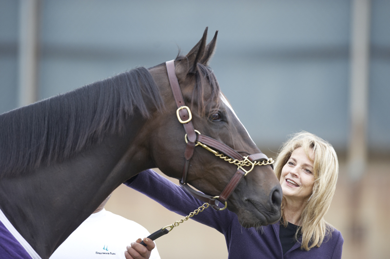 Zenyatta with nose pressed up against woman.